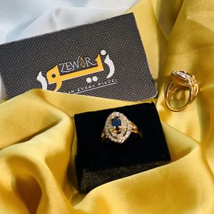 Elegant Gold Ring with Dark Blue Stone
